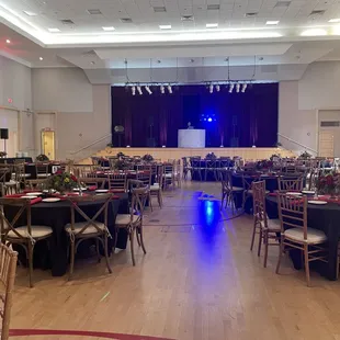 DJ Booth placed up on stage with lights and effects for dancing later in the evening.