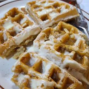 Slathered butter &amp; syrup on fluffy delicious waffle. Oops forgot to take pic of the hash browns.  Yes lots of carbs but worth it.