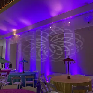 Uplights around the hall to enhance the elegant appeal to the event. With moving head pattern projected at the wall