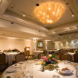 Soft colored uplighting and a custom gobo monogram ;)