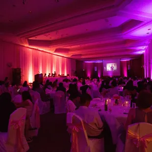 Pink Uplighting along with a Slideshow.  We can provide you with a projector and screen.