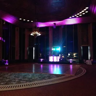 Stage set up and uplighting for a senior prom
