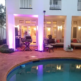 Private pool party in Kahala -uplighting effects with speakers concealed