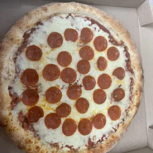 a pepperoni pizza in a box