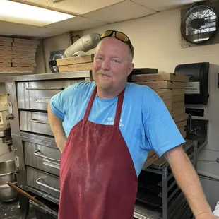 a man standing in a kitchen