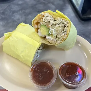 a burrito and condiments