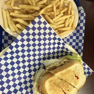 Chicken breast melt with fries.