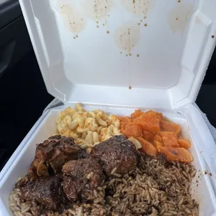 Oxtails. Candied yams, and Mac and cheese