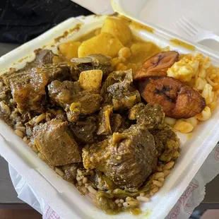 Curry Goat, Macaroni Pie and Channa and potatos