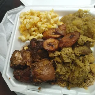 Stewed brown chicken and curried chicken with curry potatoes and mac and cheese