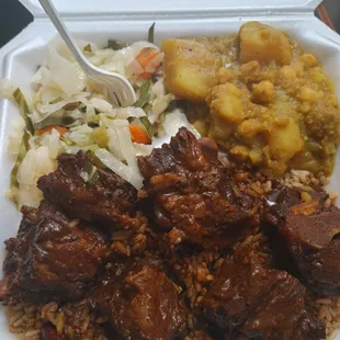 Oxtails, curried potatoes and cabbage