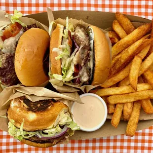 two burgers and french fries