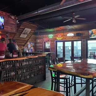 a bar with a ceiling fan