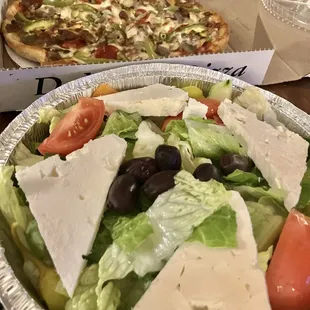 Greek salad and a small pie