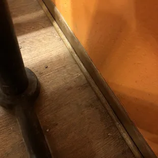 Dirty scummy floors with food droppings.