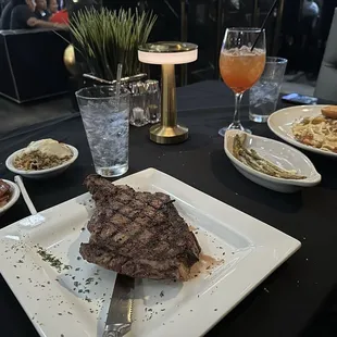 Ribeye steak, yams, dirty rice, asparagus, Cajun shrimp pasta