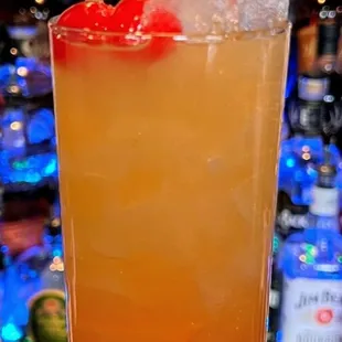 a hand holding a drink