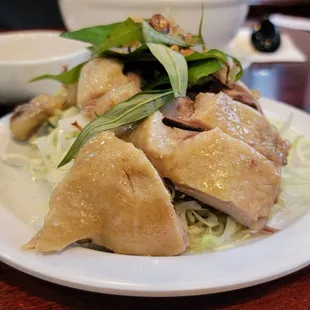 A plate of tender duck and sliced cabbage for the Bun Vit Sao Mang (Duck Bamboo Noodle Soup)