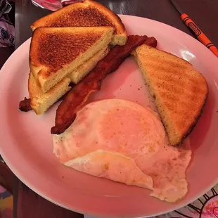 Kids egg and bacon with toast