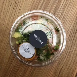 a salad in a plastic container