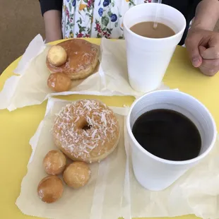 Raspberry filling and coconut topping donut