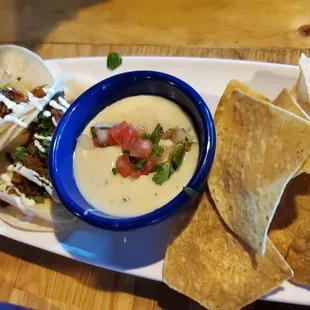 Tacos and chips with queso