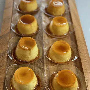 caramel flan on a wooden tray