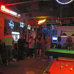 pool table and neon signs