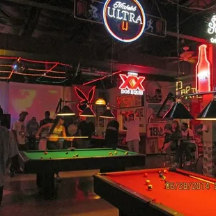 pool tables and neon signs