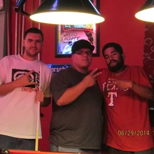 three men posing for a picture