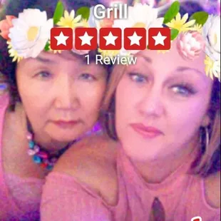 two women with flowers in their hair