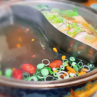 a bowl of soup with a spoon in it