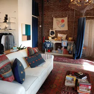 Cool spot - love the circular dressing rooms (and that light fixture!)