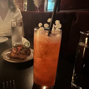 a woman sitting at a table in a restaurant