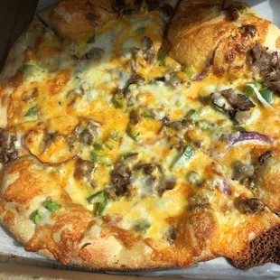 Philly cheesesteak pizza with steak, no mushrooms.