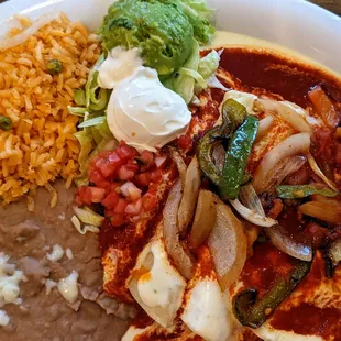 Veggie enchiladas with salsa roja.
