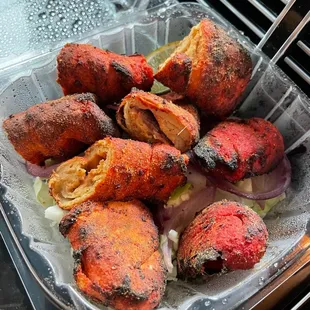 a plate of food on a grill