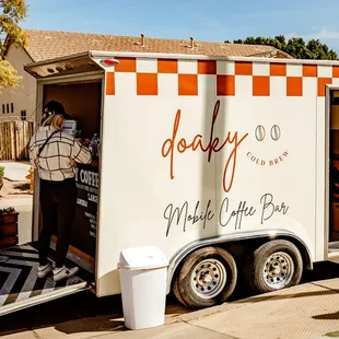 a woman opening the door of a truck