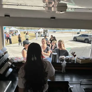 a group of people at a counter