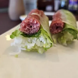 Grilled meatball fresh roll! So delicious dipped in their peanut sauce and Sriracha!