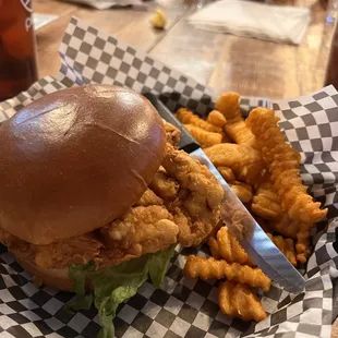 Fried chicken sandwich and seasoned crinkle fries.