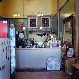 a kitchen with a refrigerator and a counter
