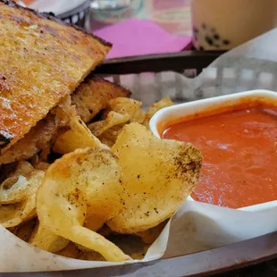 a sandwich and chips in a basket