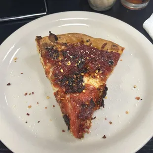 Slice of their Chicago deep dish style pizza.