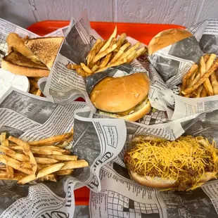 ows a tray of burgers and fries