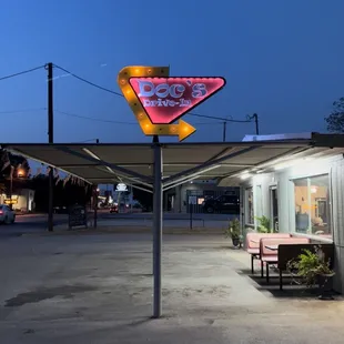 ows a neon sign for a diner