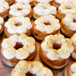 a variety of donuts with white frosting