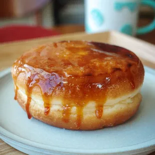 a glazed donut on a plate