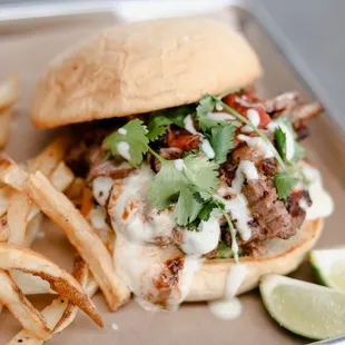 a sandwich and fries on a tray