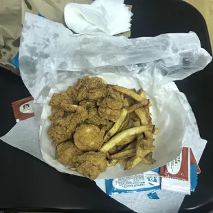 a basket of fried chicken and french fries